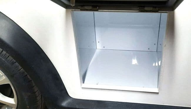 Lockable storage compartment under the loading bed for ARI 458